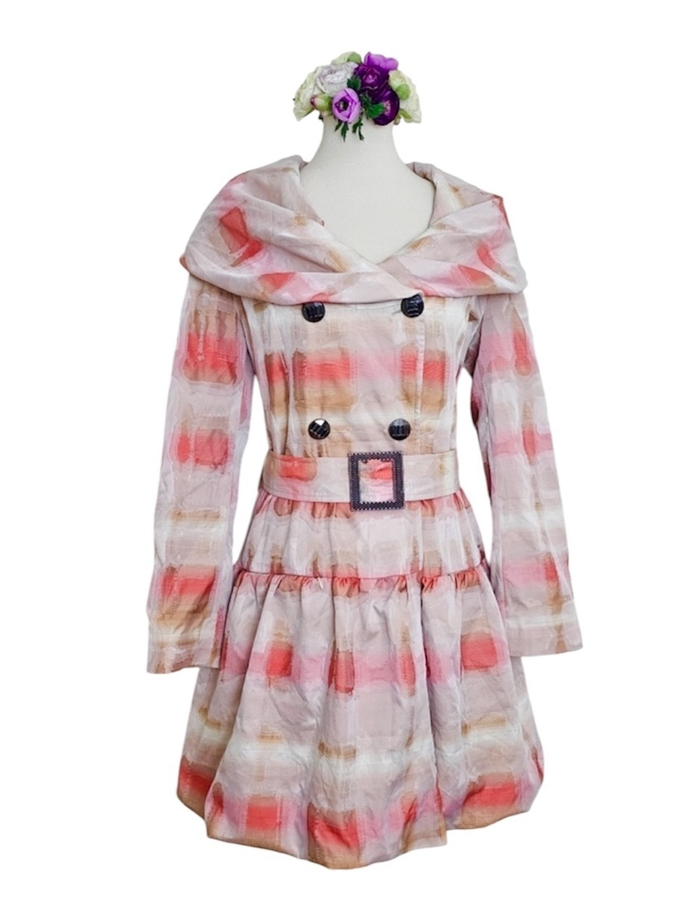 Glamorous tiered belted trenchcoat w/portrait collar.
